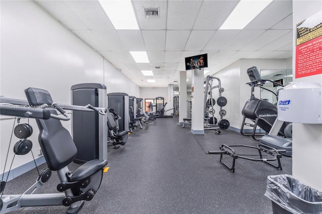 workout area with a drop ceiling