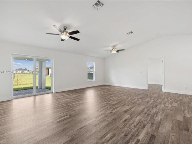 empty room featuring ceiling fan, vaulted ceiling, and hardwood / wood-style floors