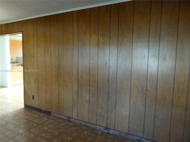 empty room featuring wooden walls