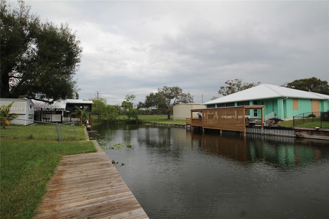 dock area with a water view