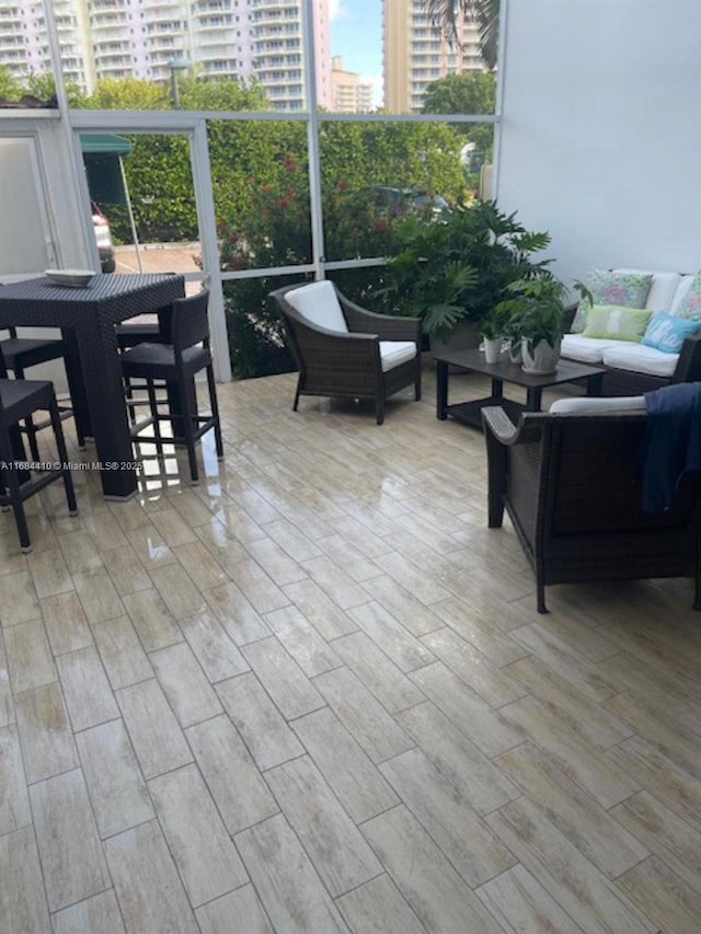 265 Grapetree Dr Unit 108, Key Biscayne, FL 33149 - sunroom / solarium featuring an outdoor living space and a city view