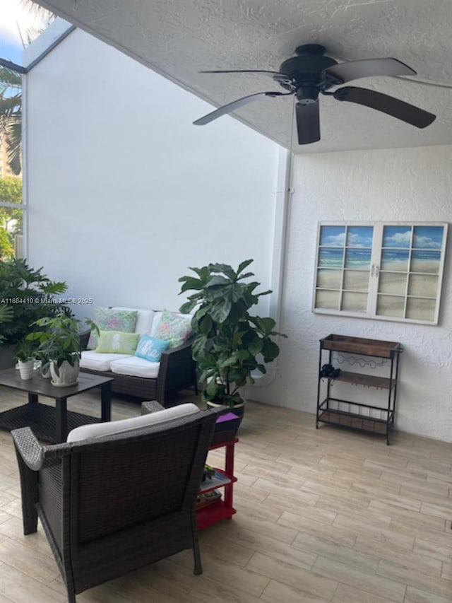 view of patio featuring ceiling fan and outdoor lounge area