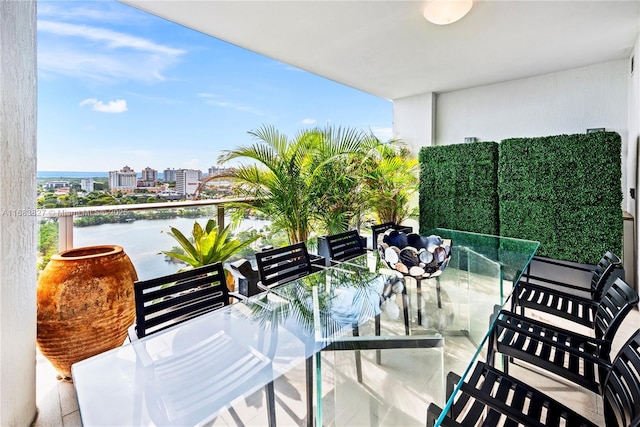 balcony featuring a water view