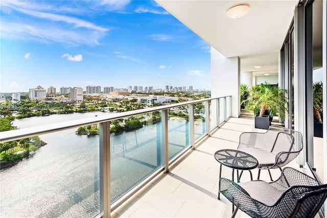 balcony featuring a water view