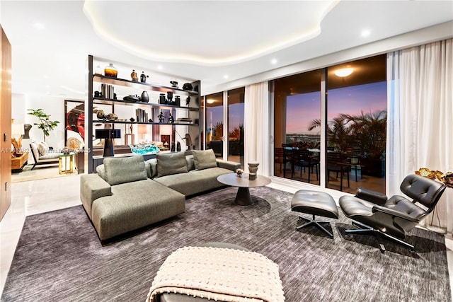 living room with a tray ceiling