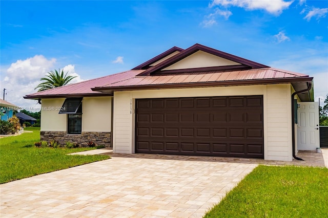 single story home with a front lawn and a garage