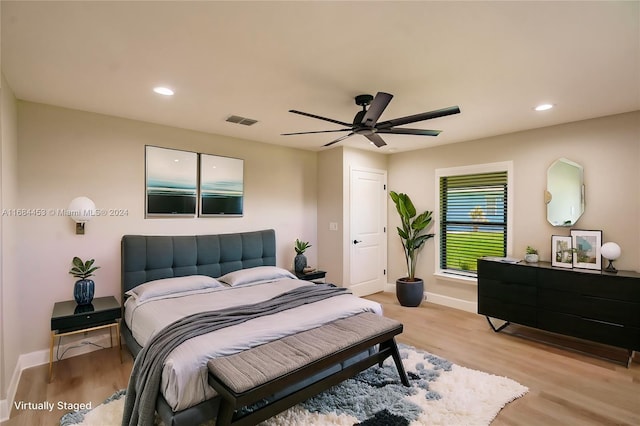 bedroom featuring light wood-type flooring and ceiling fan