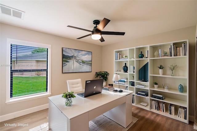 office area with hardwood / wood-style floors and ceiling fan