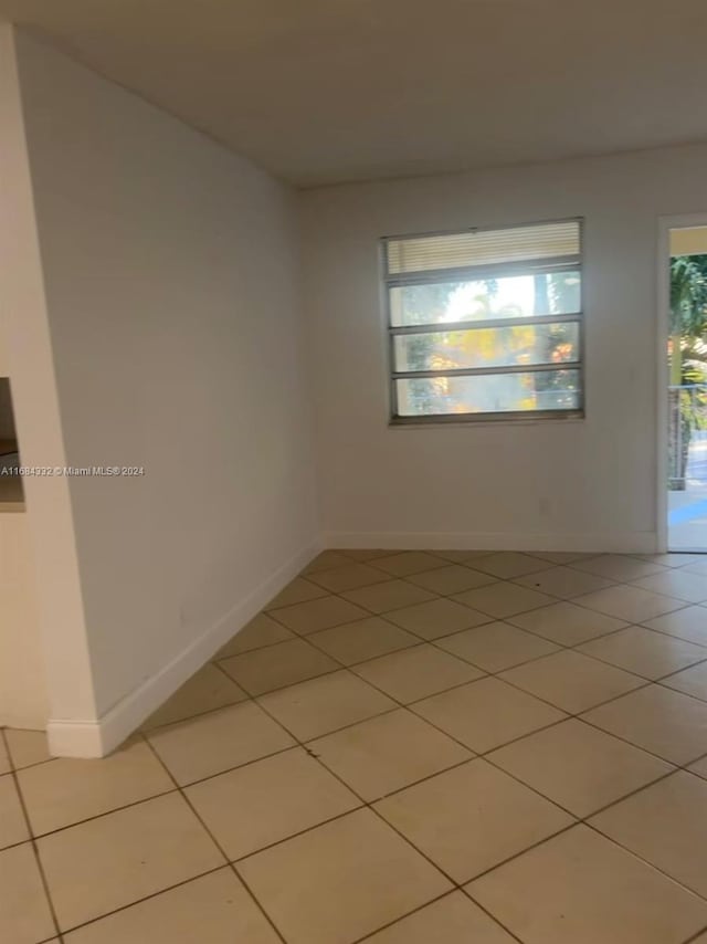 spare room with light tile patterned floors