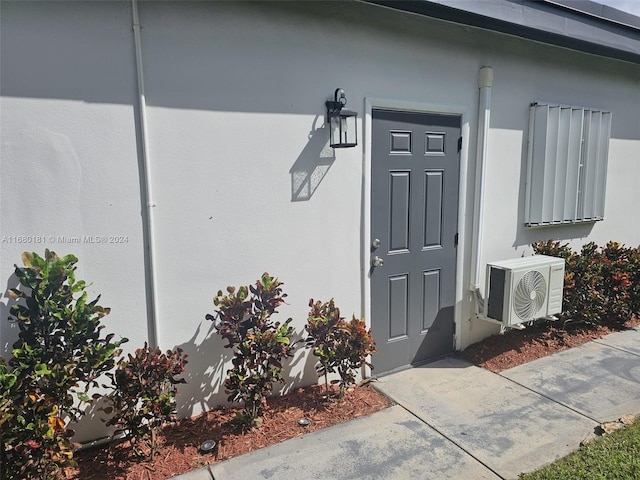 property entrance featuring ac unit