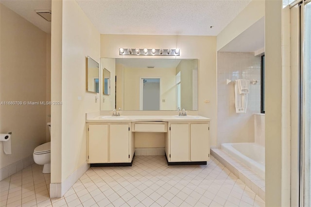 full bathroom with vanity, a textured ceiling, toilet, and tile patterned floors