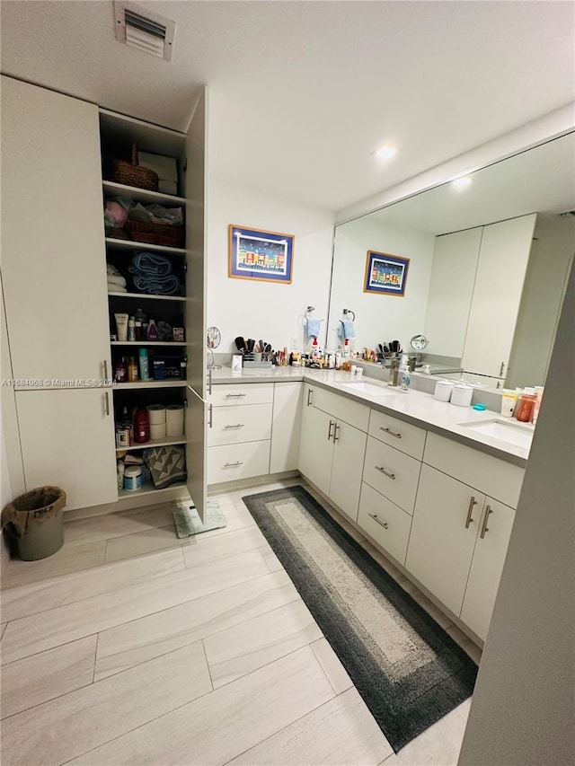 bathroom with vanity and hardwood / wood-style flooring