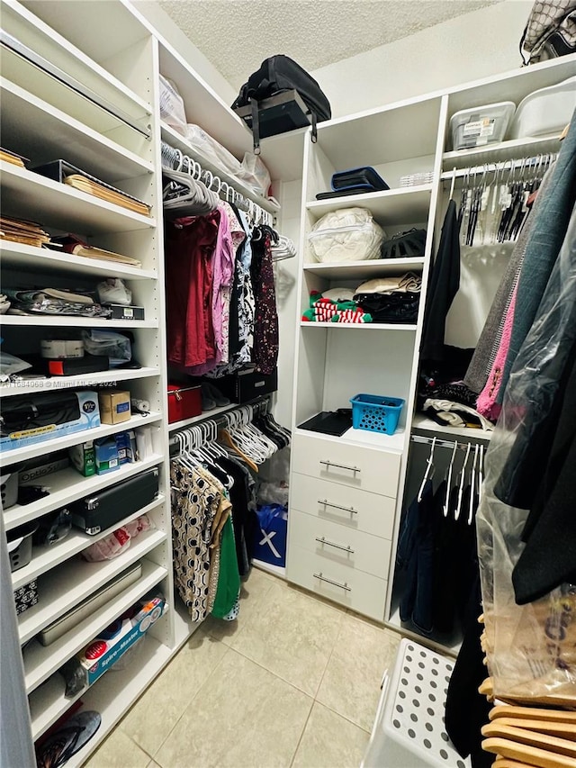 walk in closet featuring light tile patterned floors