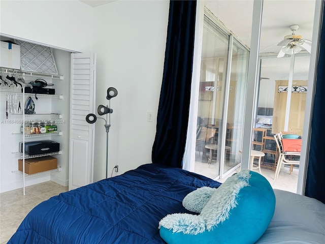 bedroom with light tile patterned floors and ceiling fan