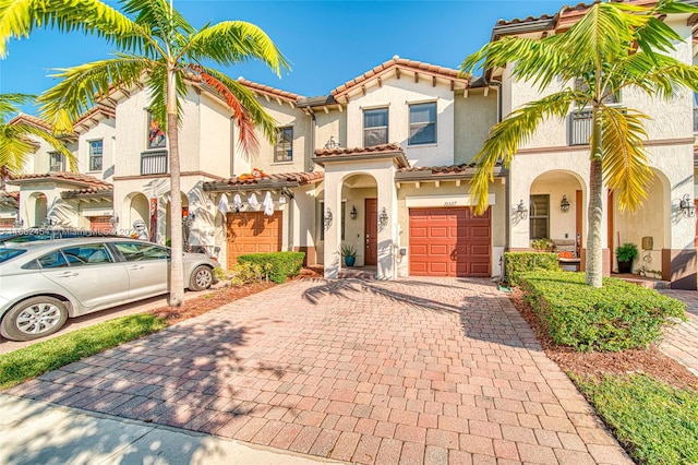 mediterranean / spanish house featuring a garage