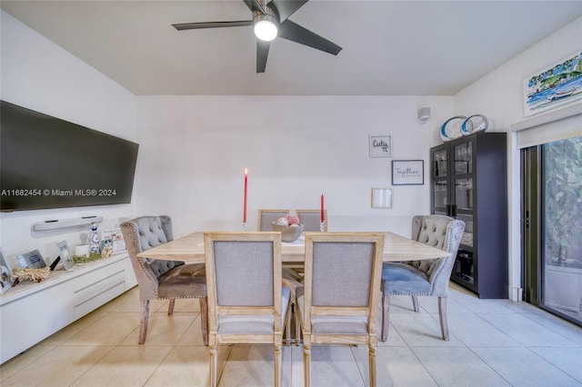 tiled dining room with ceiling fan