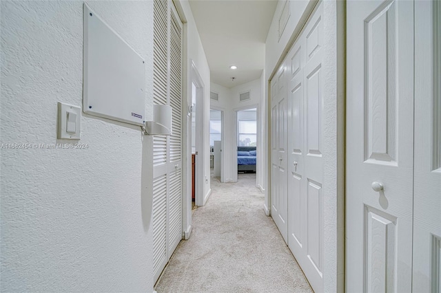 hallway with light carpet