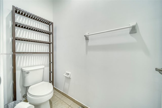 bathroom featuring toilet and tile patterned floors