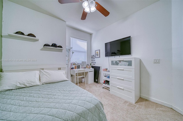 bedroom featuring light colored carpet and ceiling fan