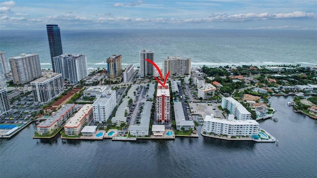 birds eye view of property with a water view