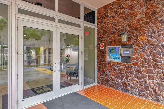 3161 S Ocean Dr Unit 203, Hallandale Beach, FL 33009 - property entrance featuring french doors and stone siding
