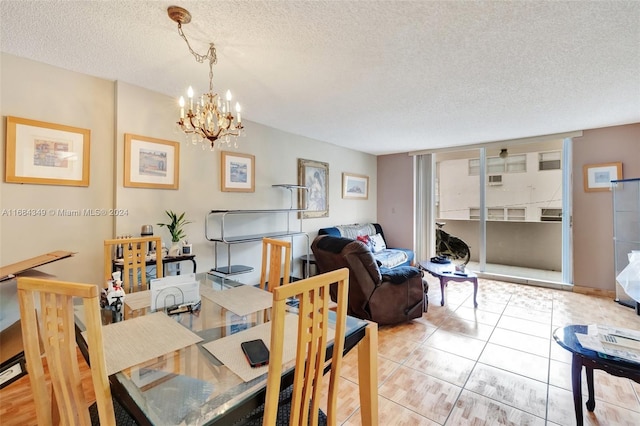 3161 S Ocean Dr Unit 203, Hallandale Beach, FL 33009 - dining space with a textured ceiling, a chandelier, and light tile patterned flooring