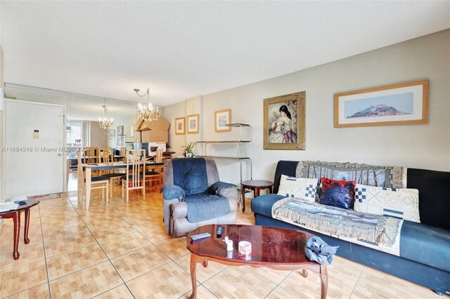 3161 S Ocean Dr Unit 203, Hallandale Beach, FL 33009 - tiled living room featuring a chandelier