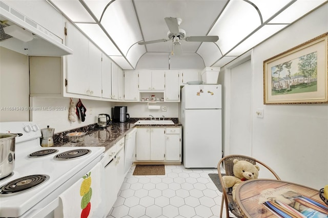 kitchen with white cabinetry, ventilation hood, and white appliances