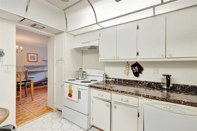 3161 S Ocean Dr Unit 203, Hallandale Beach, FL 33009 - kitchen featuring white appliances, under cabinet range hood, a chandelier, dark stone countertops, and light tile patterned floors