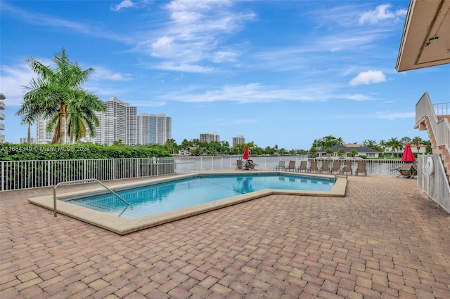 view of swimming pool with a patio area