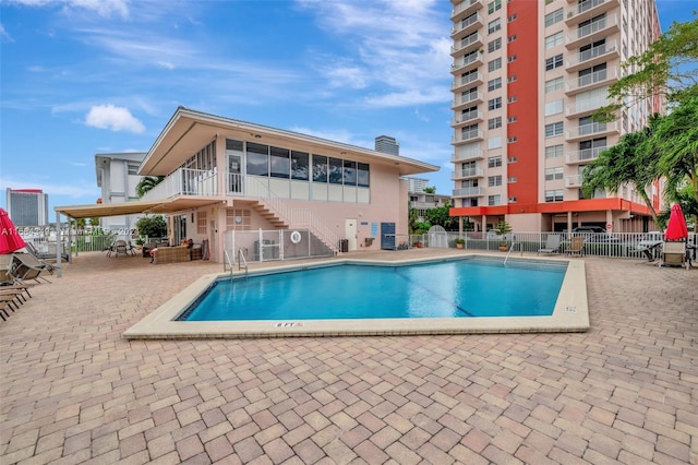 view of swimming pool with a patio area