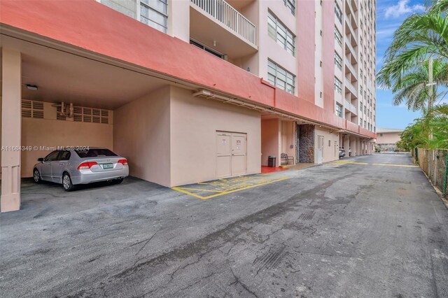 3161 S Ocean Dr Unit 203, Hallandale Beach, FL 33009 - view of building exterior featuring parking