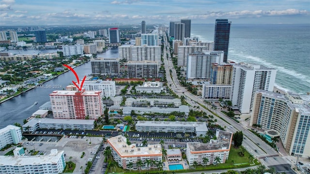 birds eye view of property with a water view