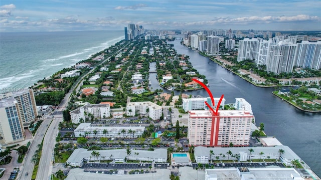 birds eye view of property featuring a water view