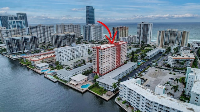 birds eye view of property with a water view