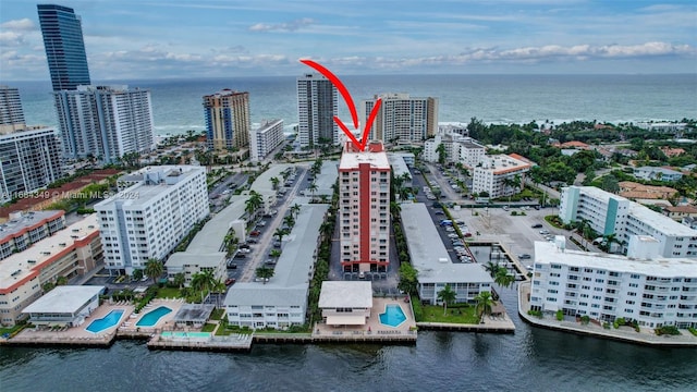 birds eye view of property featuring a water view