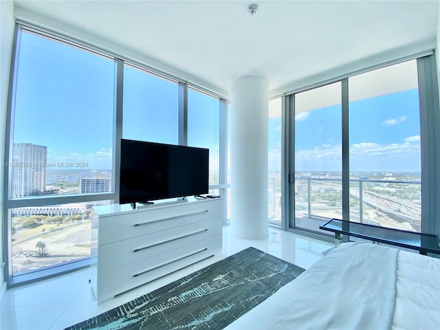 bedroom featuring multiple windows and tile patterned floors