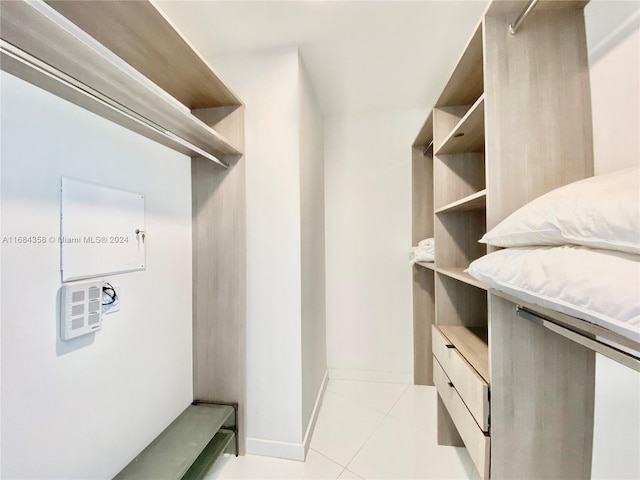 spacious closet with light tile patterned flooring