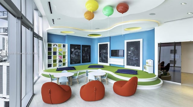 recreation room featuring light hardwood / wood-style floors