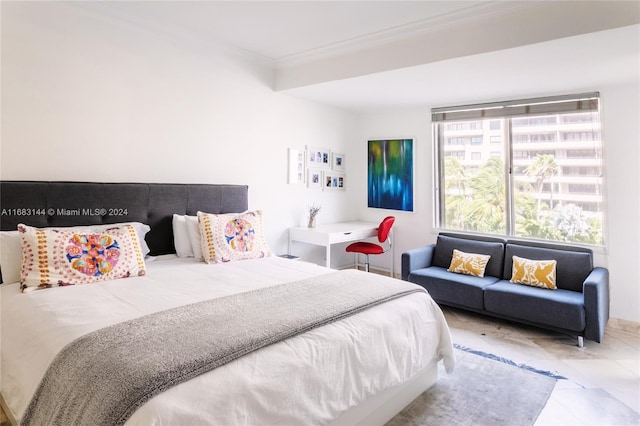 bedroom with light tile patterned floors and ornamental molding