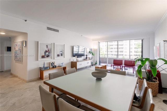 dining room with crown molding