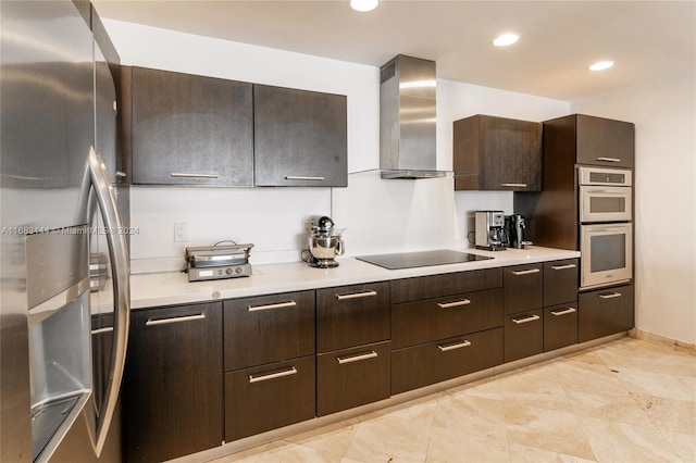 kitchen with dark brown cabinets, stainless steel appliances, and wall chimney range hood