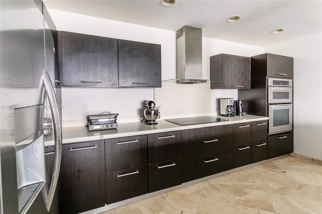 kitchen featuring dark brown cabinets, wall chimney range hood, and stainless steel appliances