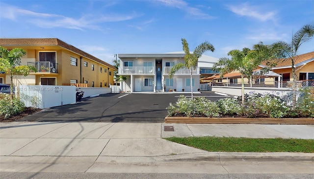 view of front of house featuring a balcony