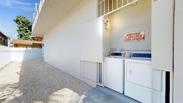 exterior space with independent washer and dryer