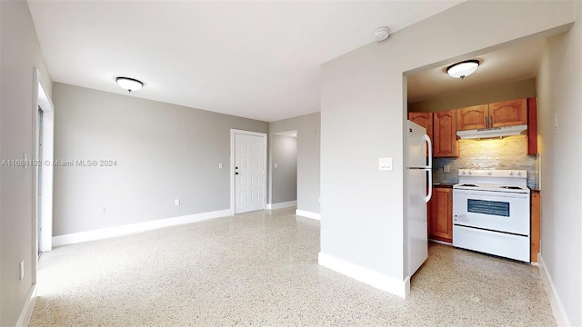 kitchen with decorative backsplash and white appliances