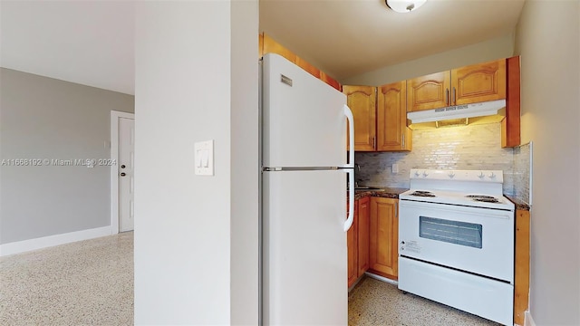 kitchen featuring white appliances and decorative backsplash