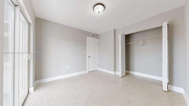 unfurnished bedroom featuring a closet