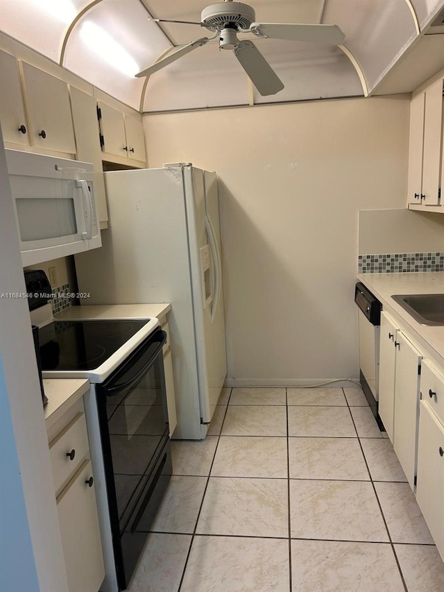 kitchen featuring sink, light tile patterned floors, white cabinets, white appliances, and ceiling fan