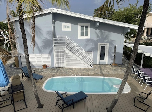 view of pool with a wooden deck